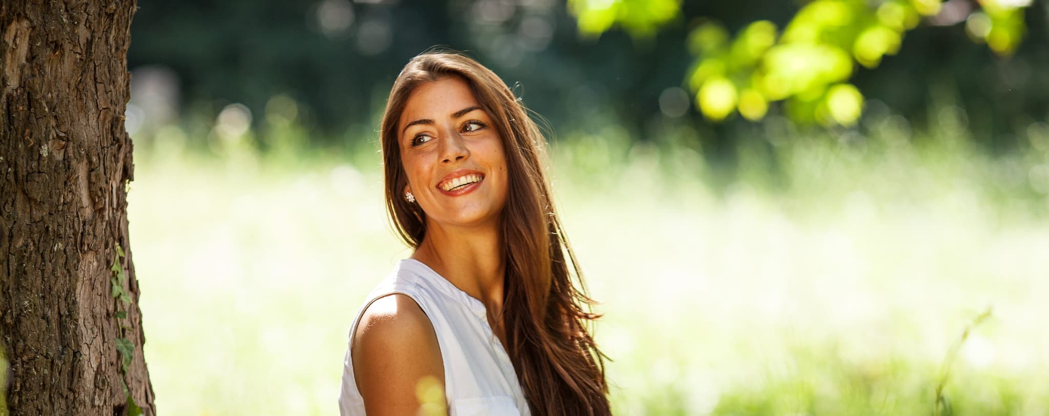 Picture of beautiful woman smiling in field