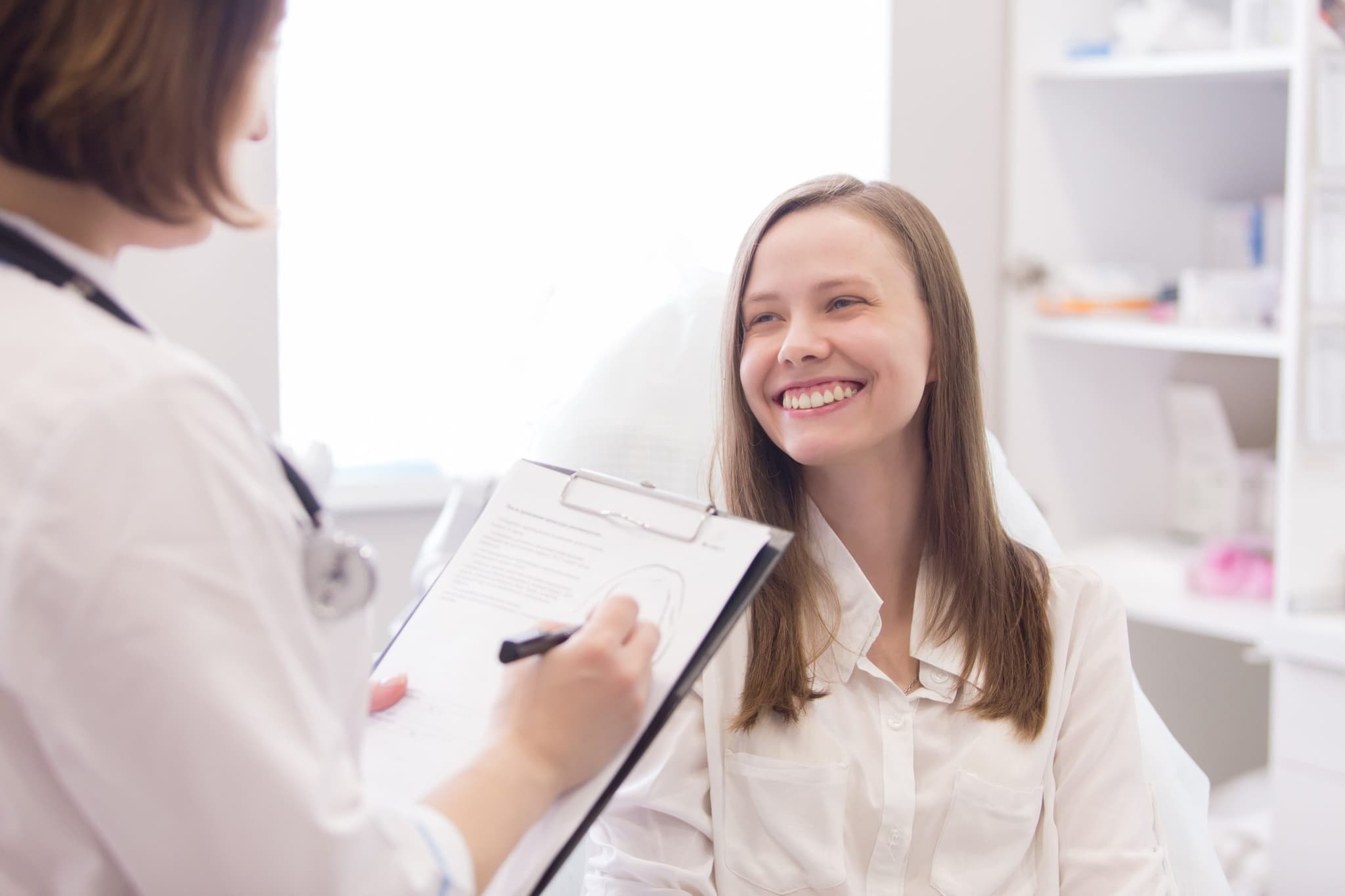 Image of a doctor explaining something to a patient. Price Adult and Adolescent Medicine is available to help you today!
