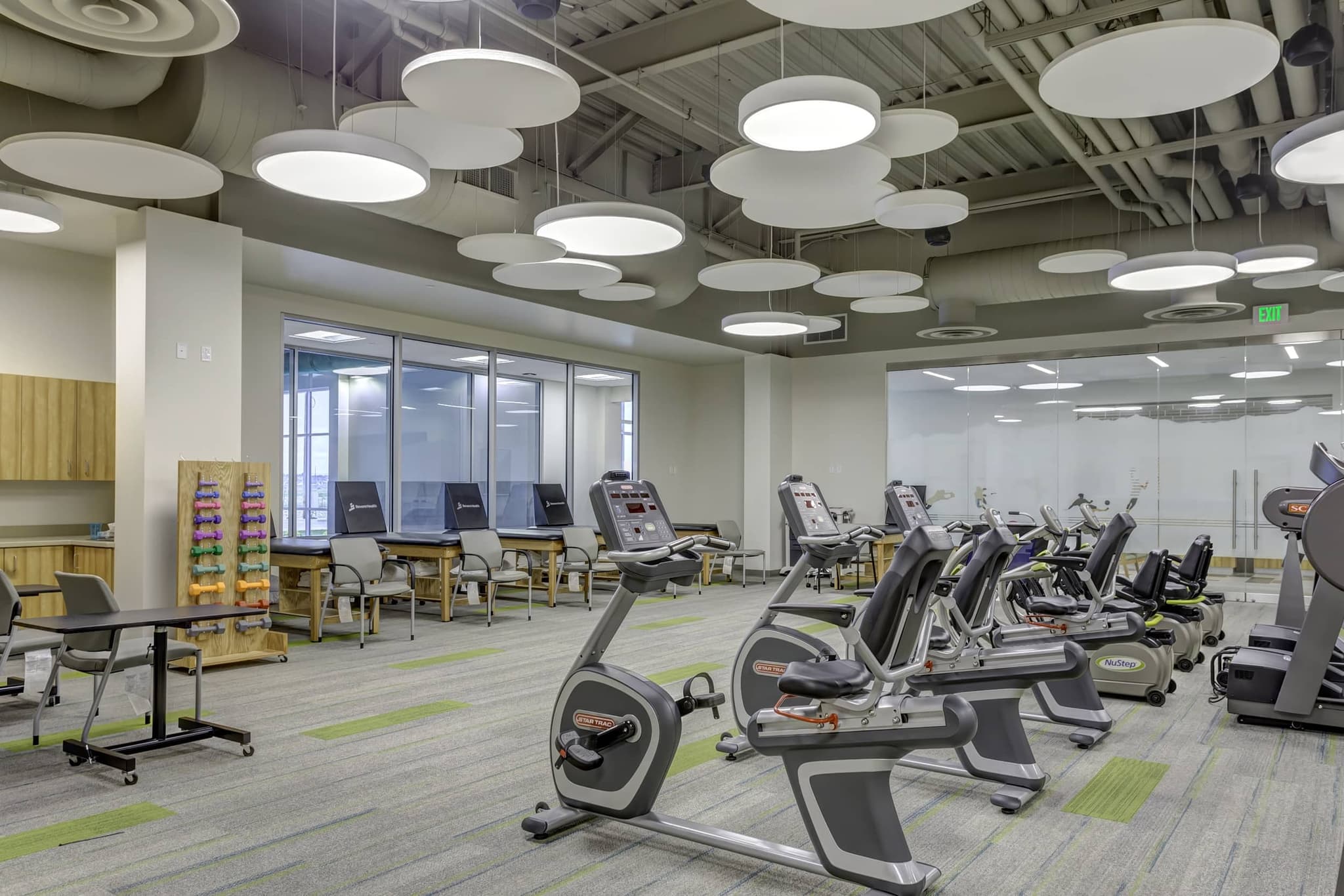 Image of a room full of cardio equipment such as bikes and treadmill for physical therapy. Visit Revere Health in Salem for your physical therapy needs. Rehabilitation and sports fitness training programs designed specifically for you. Call today!