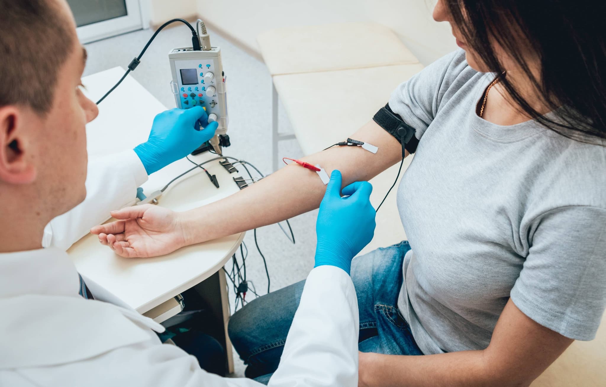 Image of a doctor performing an electrical test on a patient. Our providers are specially trained to treat conditions related to muscles, tendons and nerves. We stay up to date on the latest techniques and services in order to provide state-of-the-art orthopedic care.