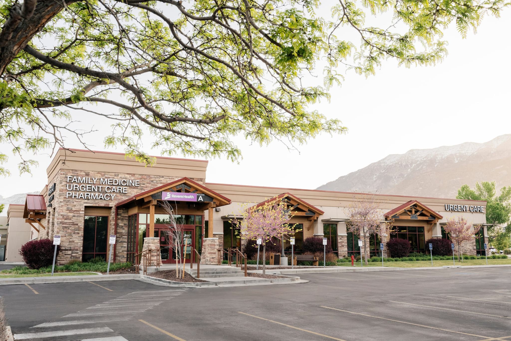 Exterior view of clinic showing the Revere Health Weight Loss & Nutrition building with stonework and surrounding landscape.