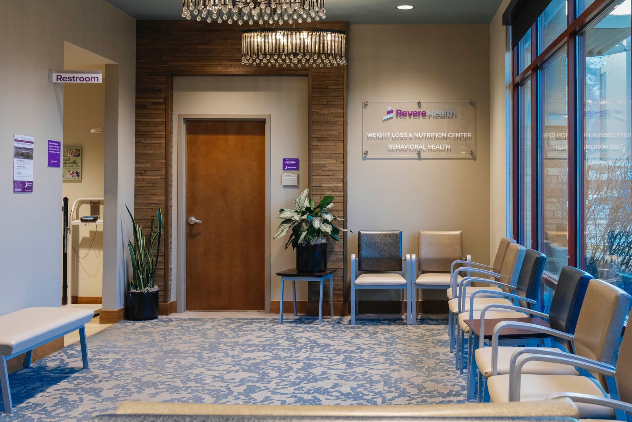 Waiting Area with signage for Revere Health Weight Loss and Nutrition, featuring seating and welcoming lighting.