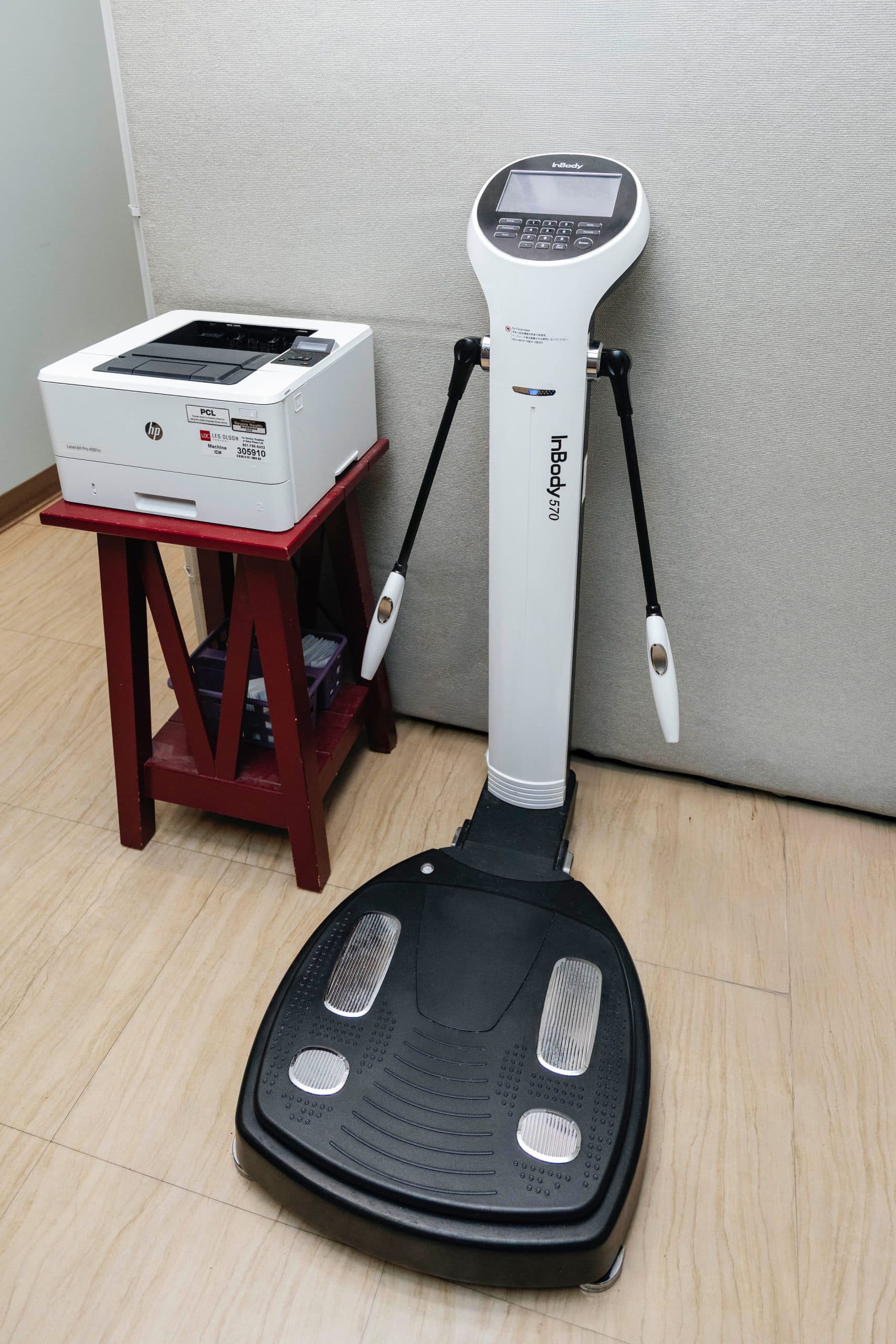 Body composition analysis machine for measuring weight, fat percentage, and metabolic metrics as part of the patient intake process.