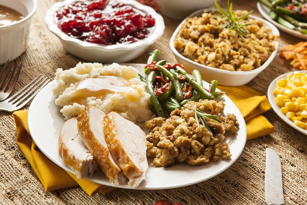 Picture of Homemade Turkey Thanksgiving Dinner with Mashed Potatoes, Stuffing, and Corn