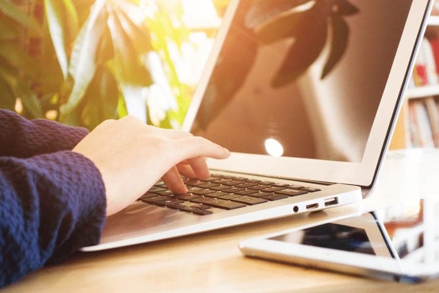 Picture of person typing on laptop