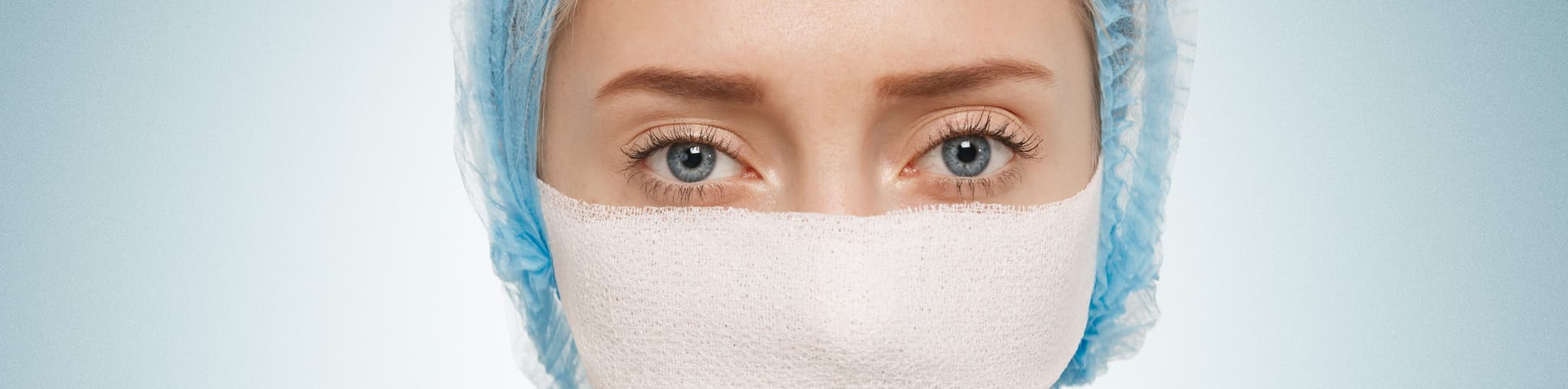 Picture of woman with bandage over nose - cosmetic surgery - Recovering from cosmetic surgery