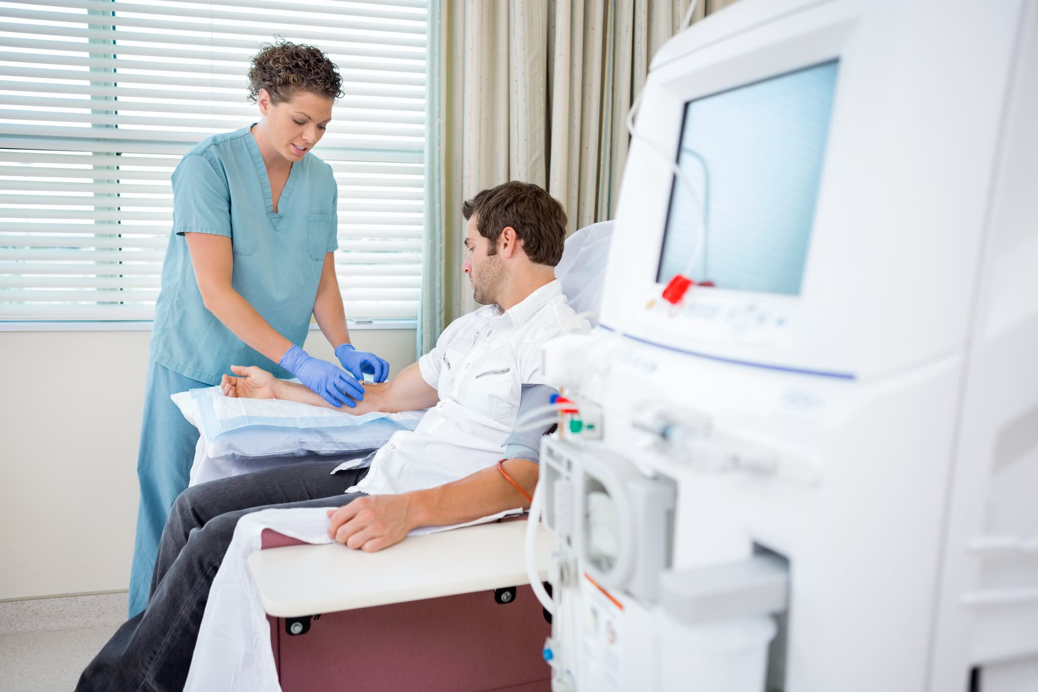 Picture of Nurse Injecting Patient For Renal Dialysis Treatment