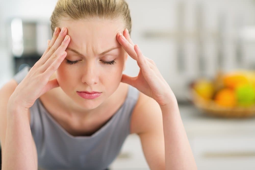 Picture of Portrait of stressed young housewife in modern kitchen