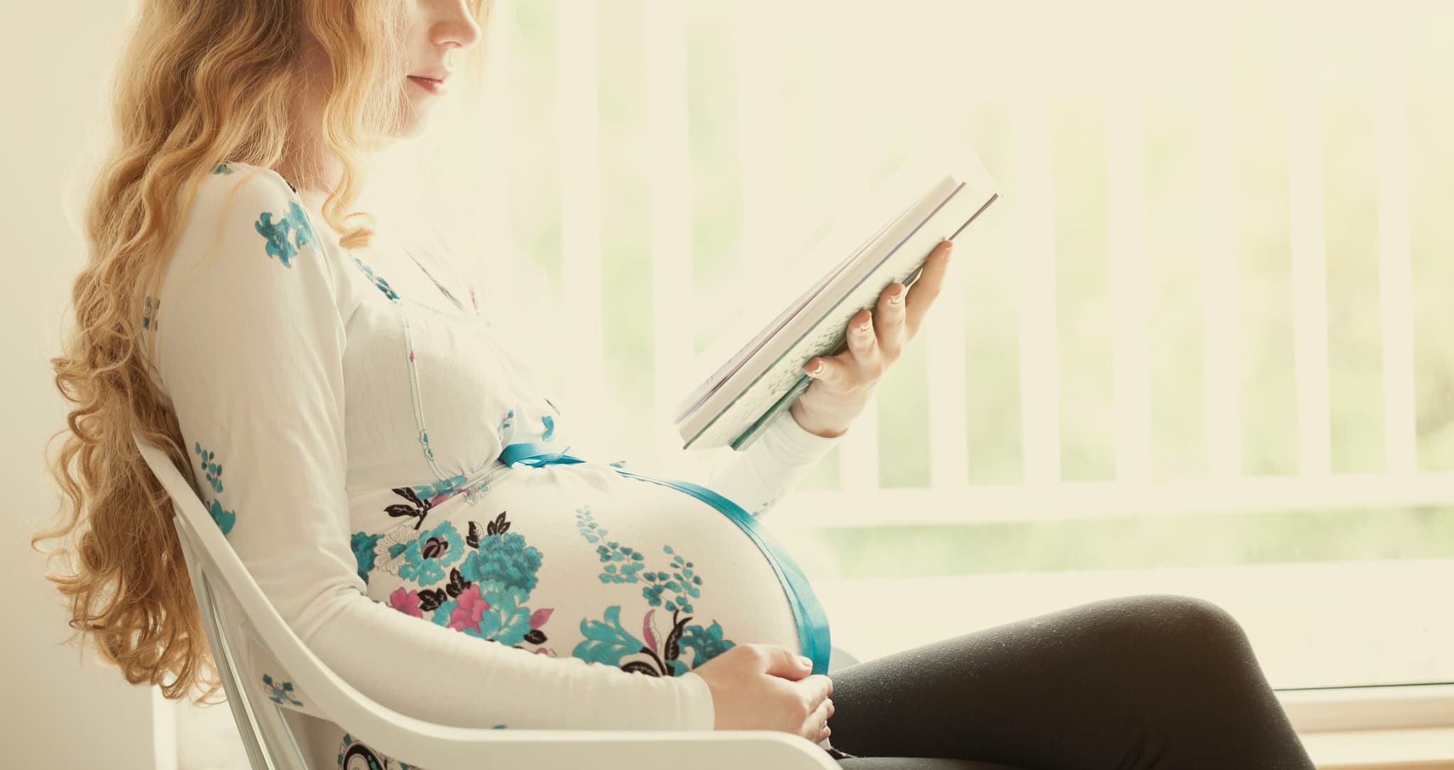 Picture of pregnant woman reading book