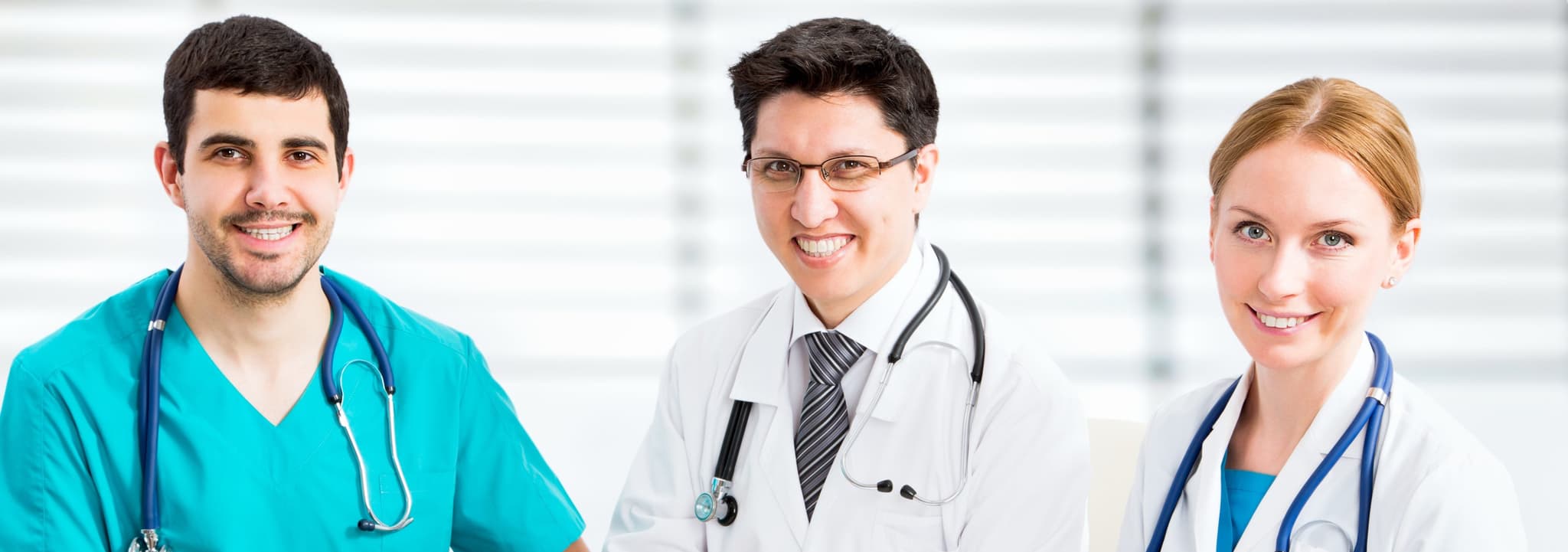 smiling doctors sitting around table