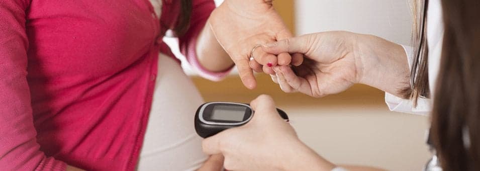 Picture of doctor checking patients Risks of Pregnancy and Diabetes