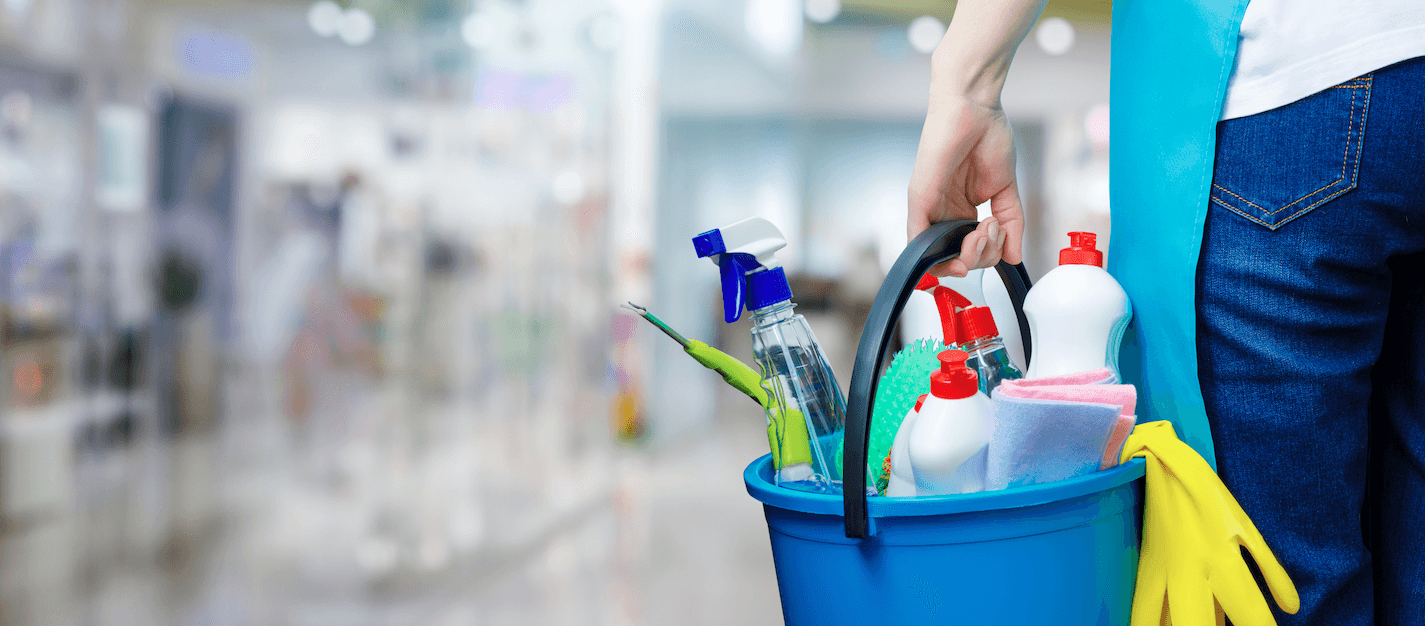 Picture of person holding bucket of cleaning supplies