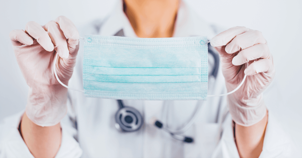 Picture of doctor holding mask