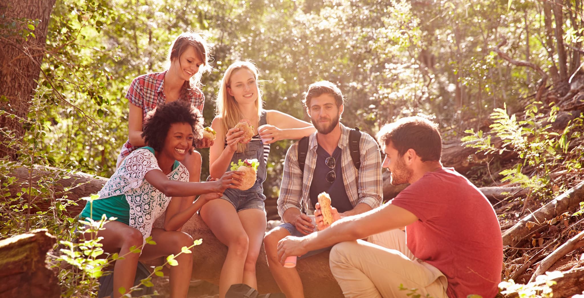 Picture of group of friends eating food outside together