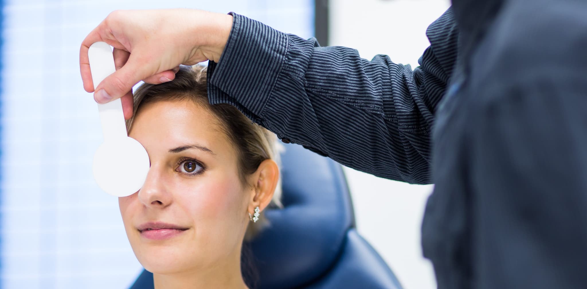 Picture of woman getting eye's tested by doctor - Glaucoma