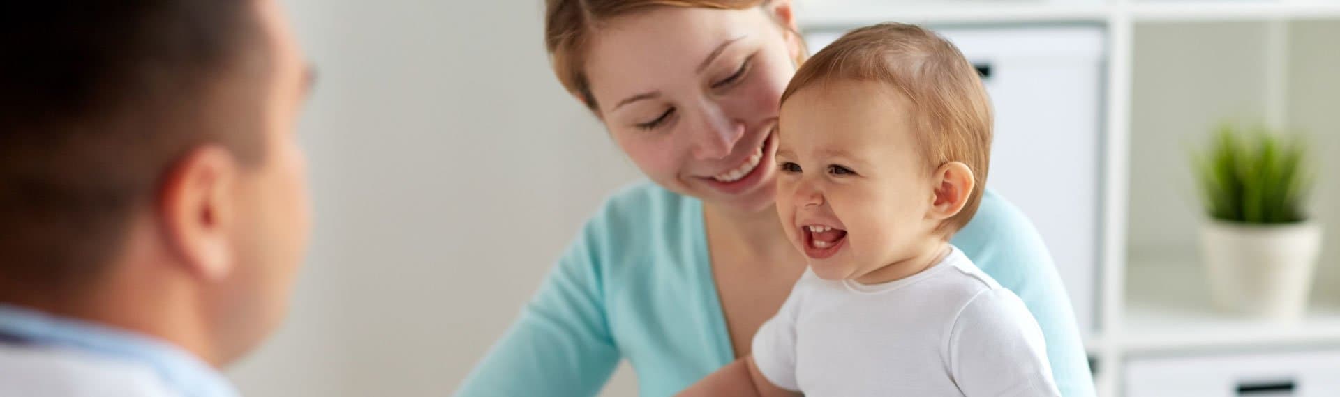 mother with happy child at the doctors