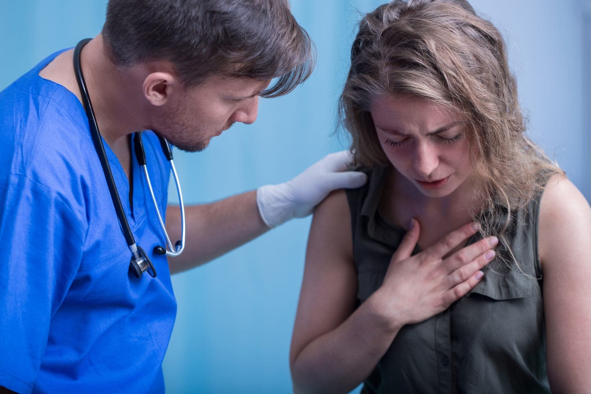 Picture of Doctor helping young beautiful girl has problem with breathing