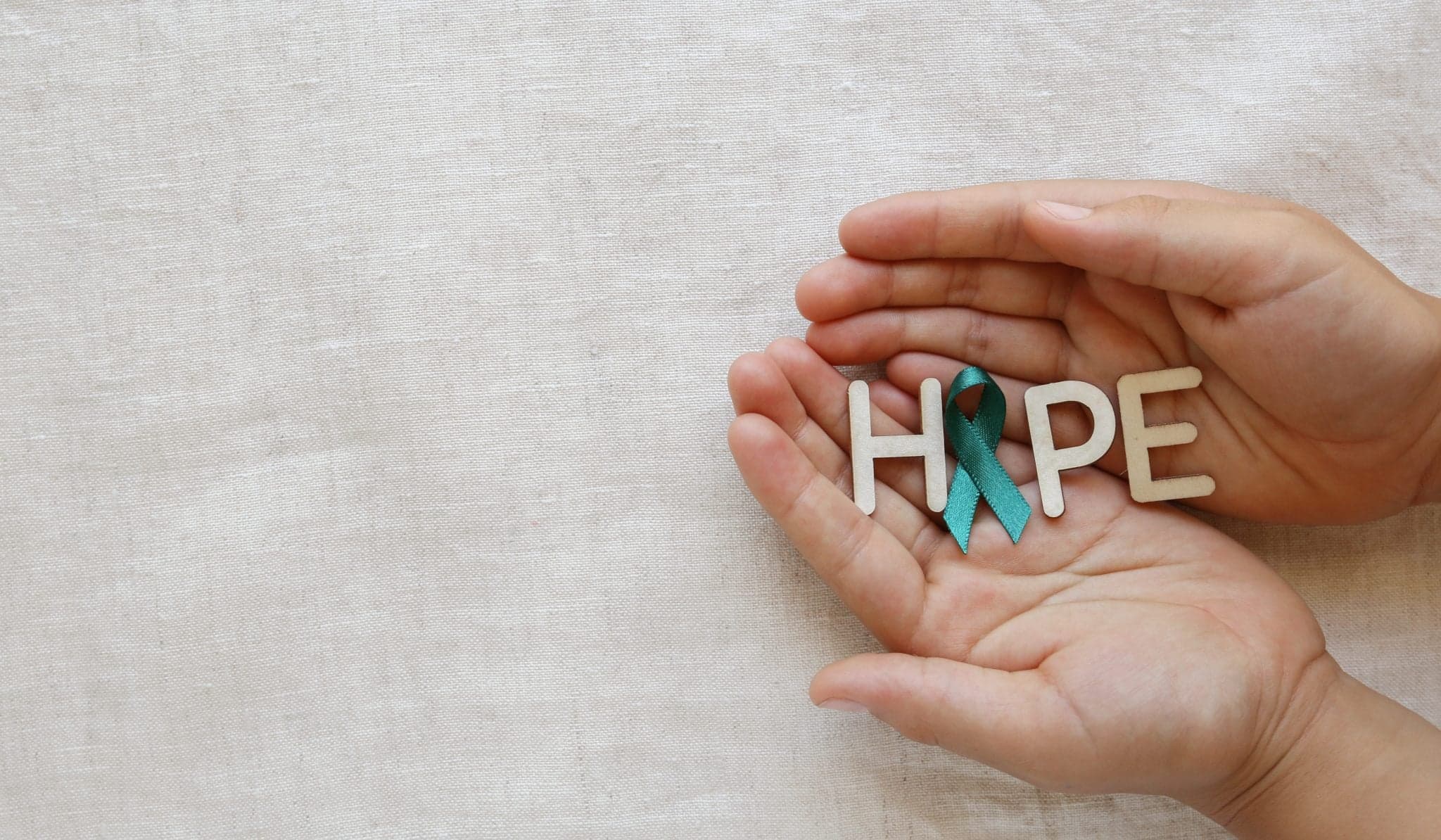 Picture of HOPE with Teal Ribbon on hands, Ovarian Cancer, cervical Cancer, Kidney Cancer awareness