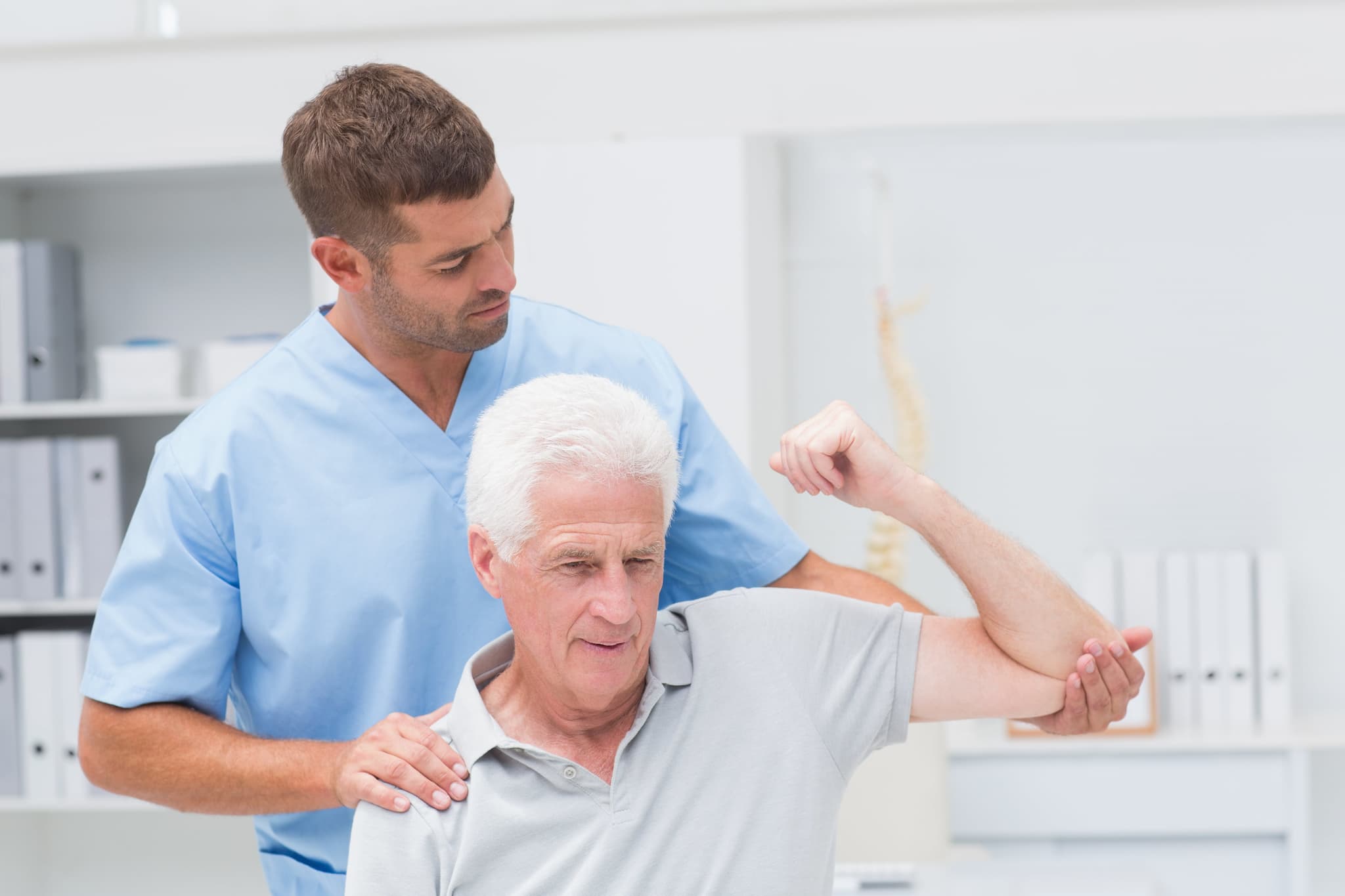 Picture of Physiotherapist giving physical therapy to man