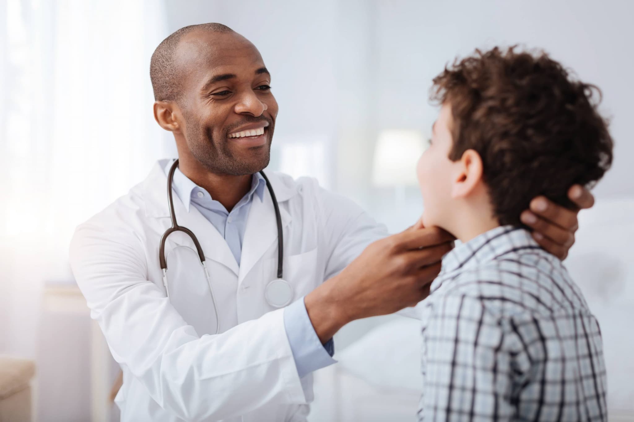 doctor performing check up on child