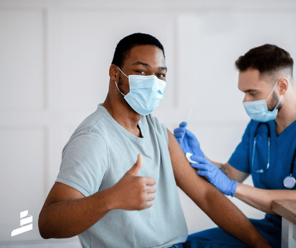 Image of happy man receiving a vaccine