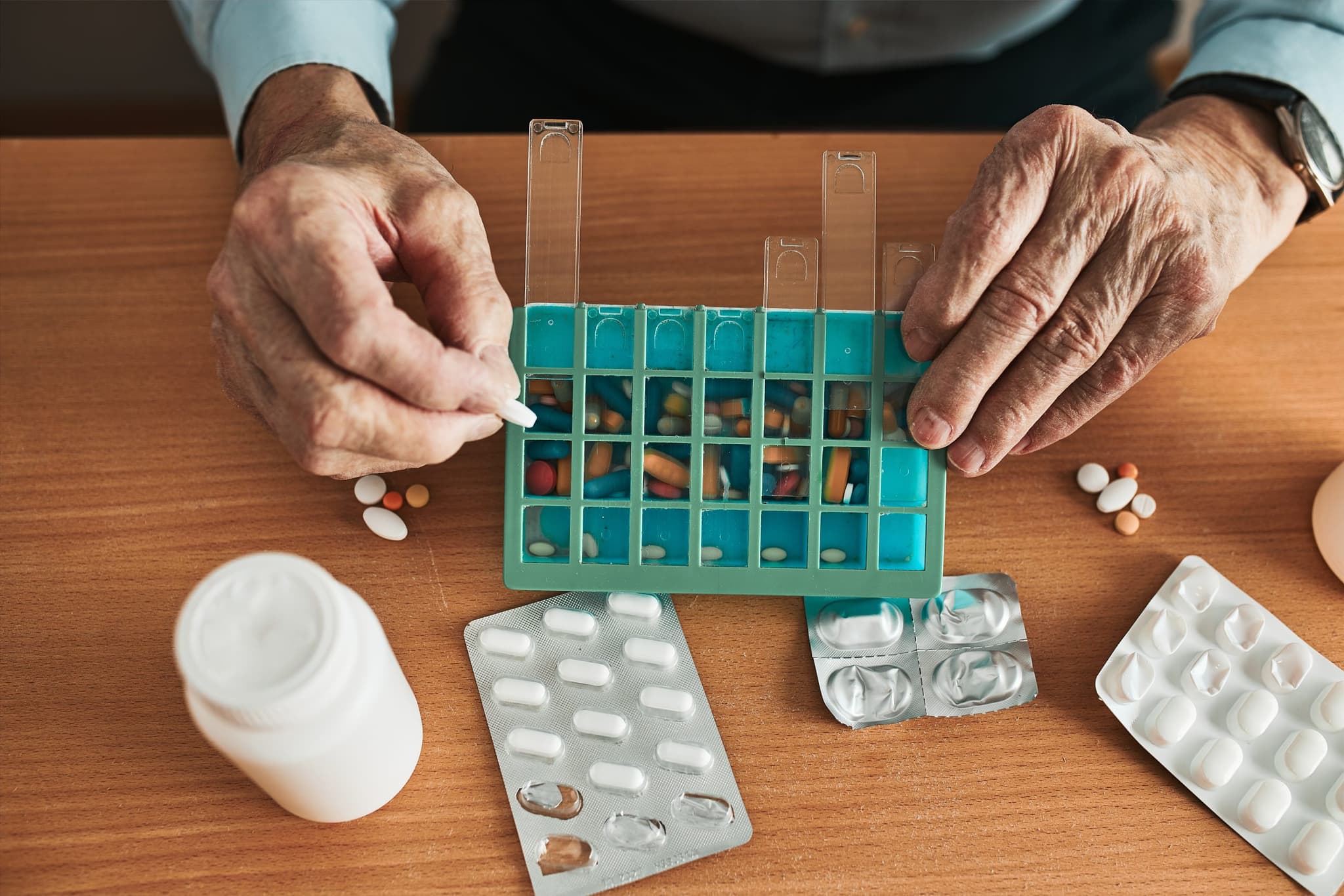 Picture of Managing medications and polypharmacy in aging adults. Discover tips for safer medication use, deprescribing, & reducing the risks of adverse effects.