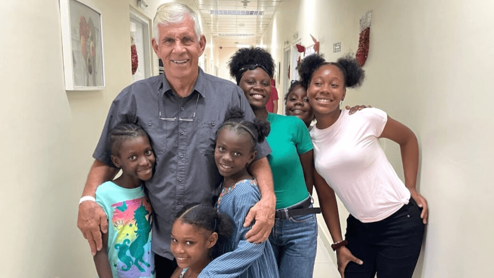 Image of Dr. Tom Dickinson, former president and chair of the board at Revere Health providing medical services and hope to families in the Dominican Republic