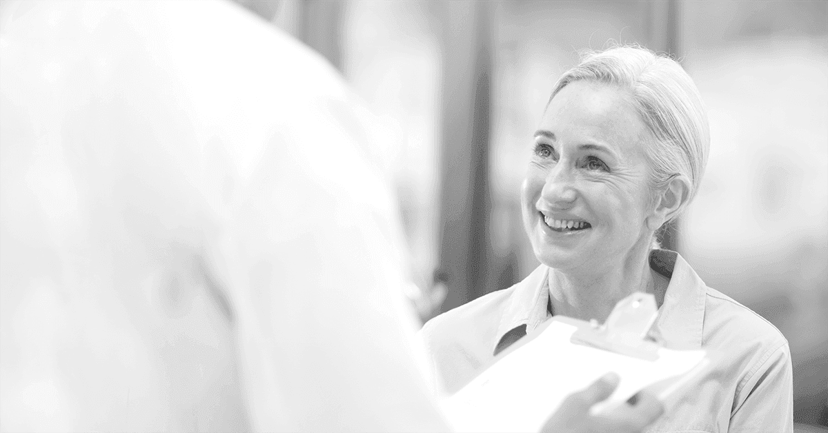 Picture of doctor talking to elderly patient