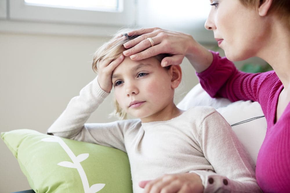 child suffering from headache