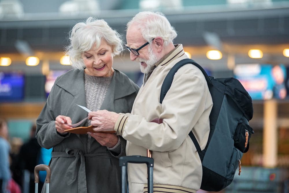 Picture of Cheerful old man and woman are waiting for their journey