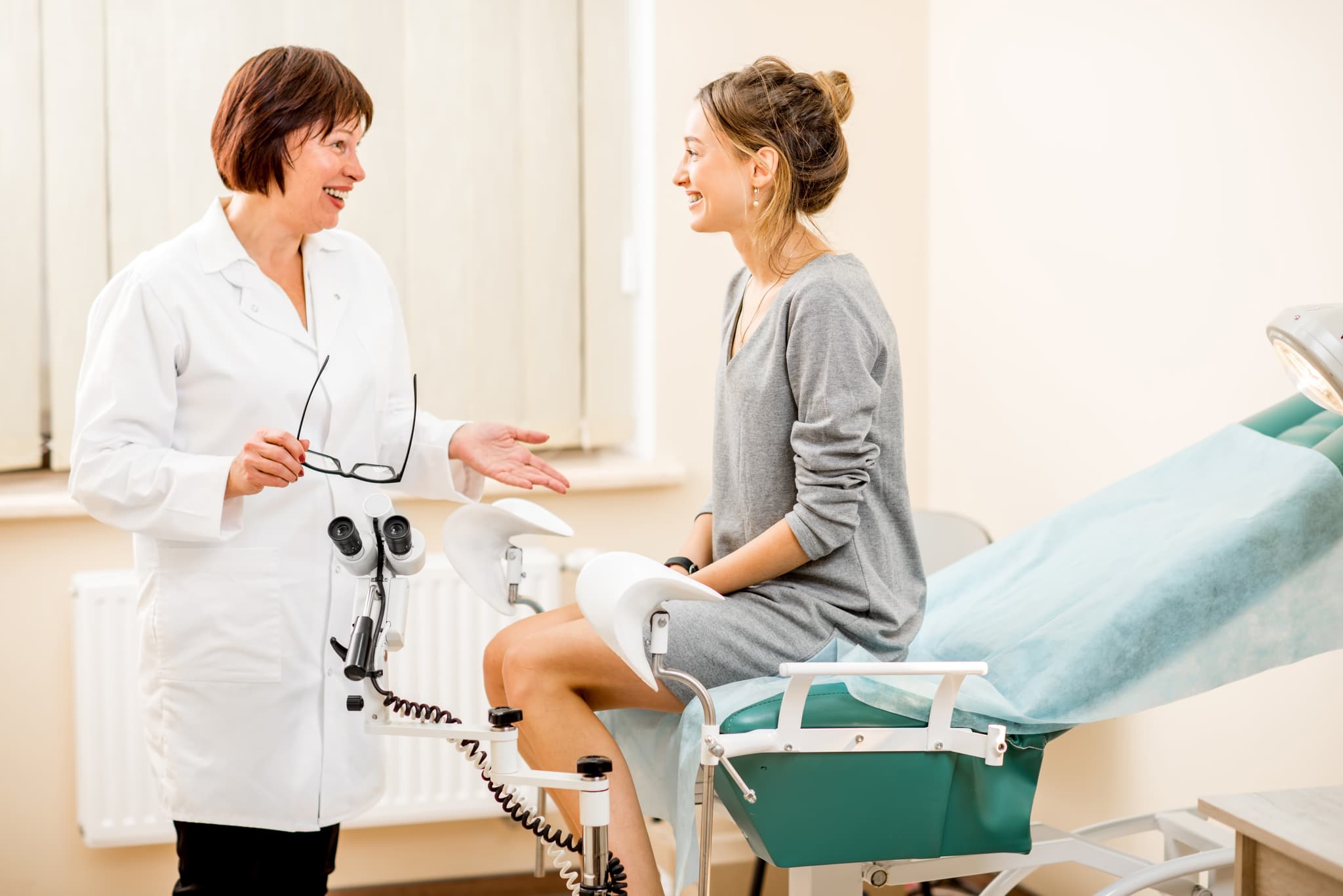 Picture of Young woman patient with a senior gynecologist during the consultation in the gynecological office