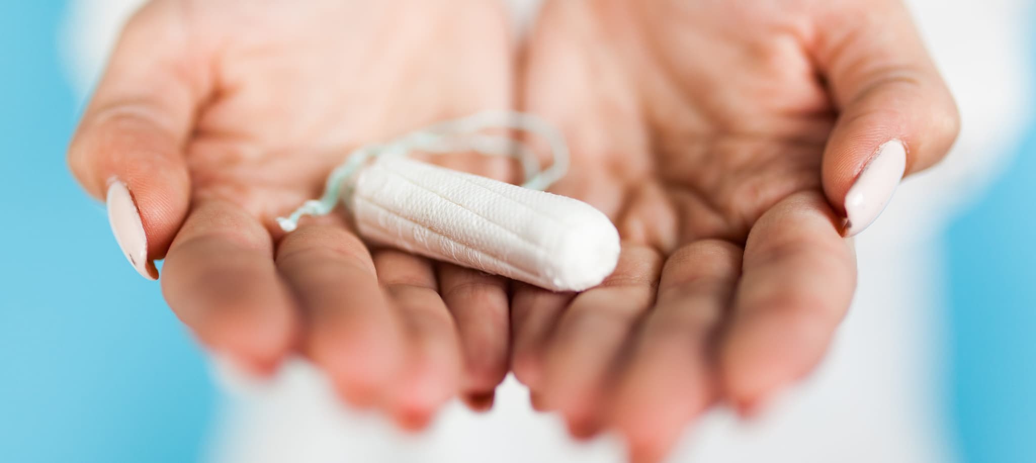 Woman holding a tampon