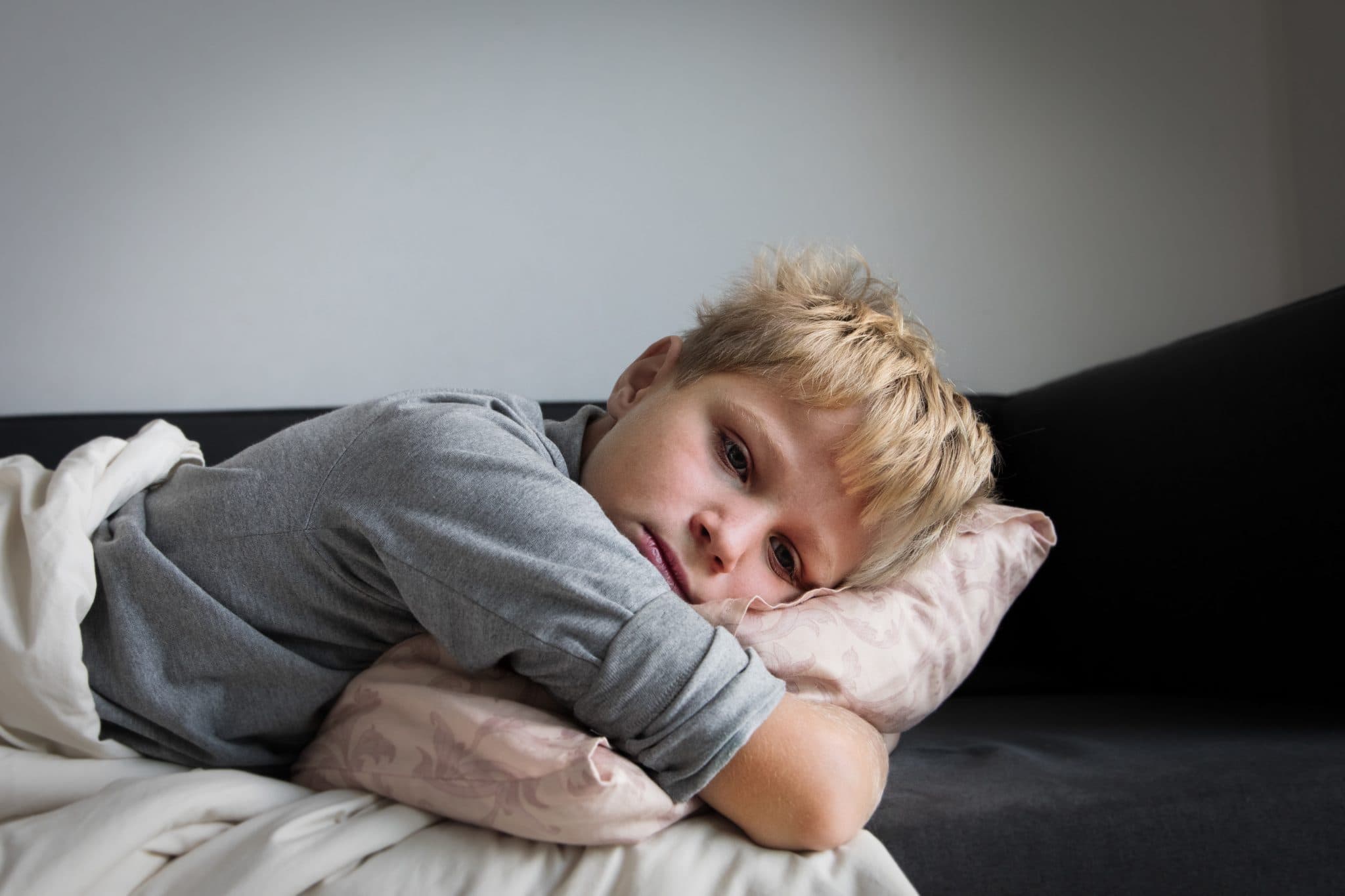 Picture of Sick child with fever at home, kid with headache, pain concept