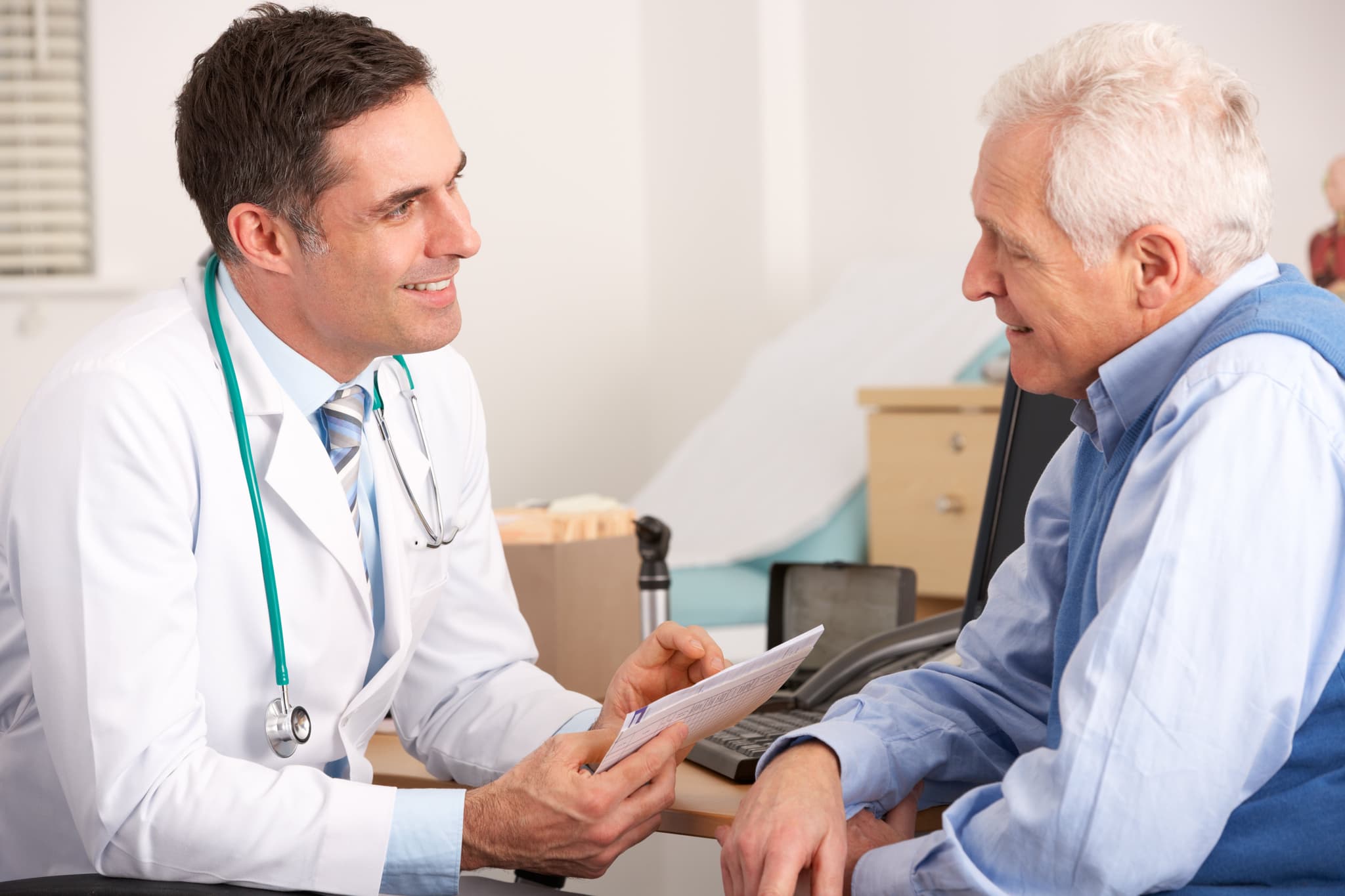 Picture of Doctor talking to senior man in surgery