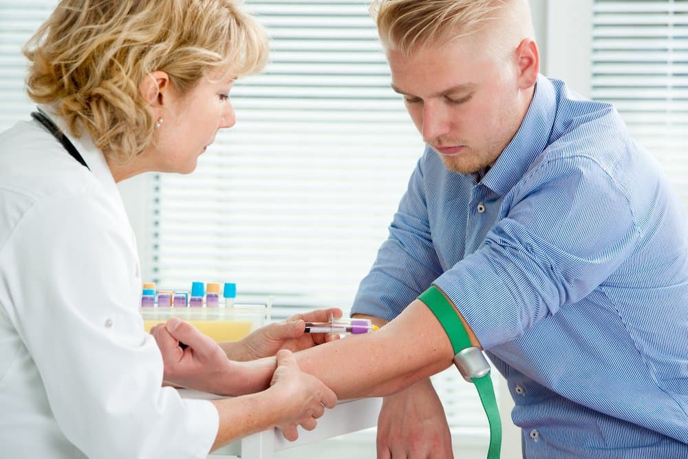Nurse taking blood sample