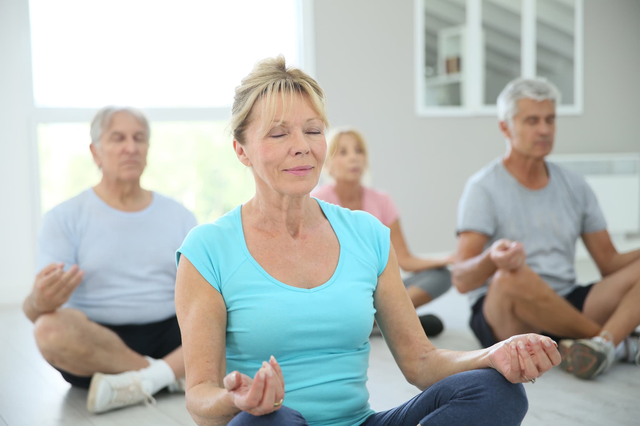 Picture of Group of senior people doing yoga exercises