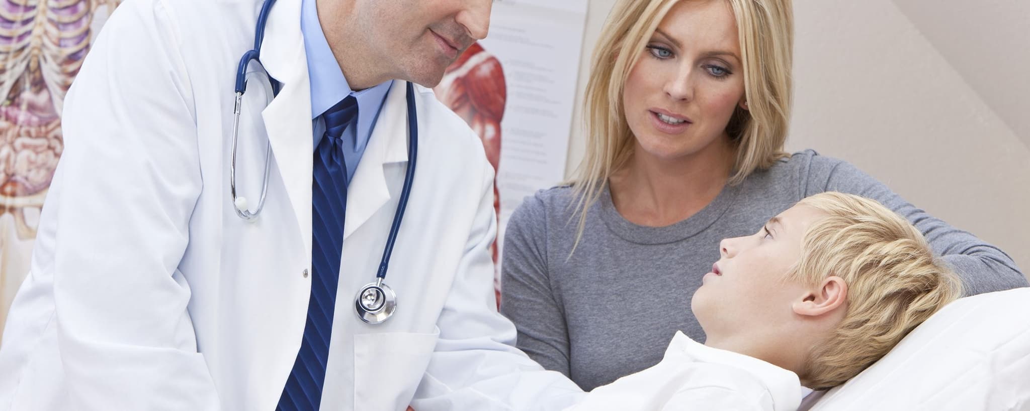 Picture of sick boy having check up with Family doctor