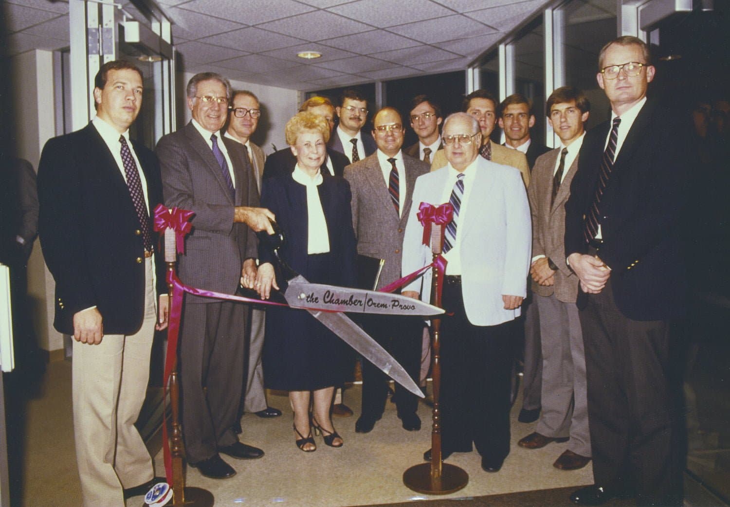 Image of dated photo of people gathered for grand opening