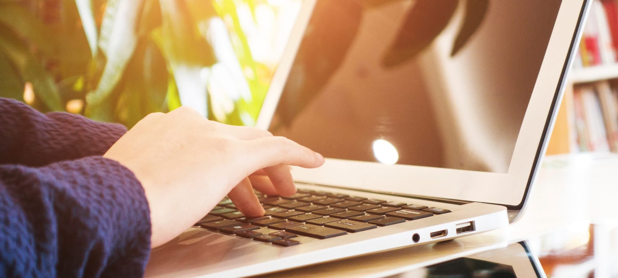 person typing on laptop