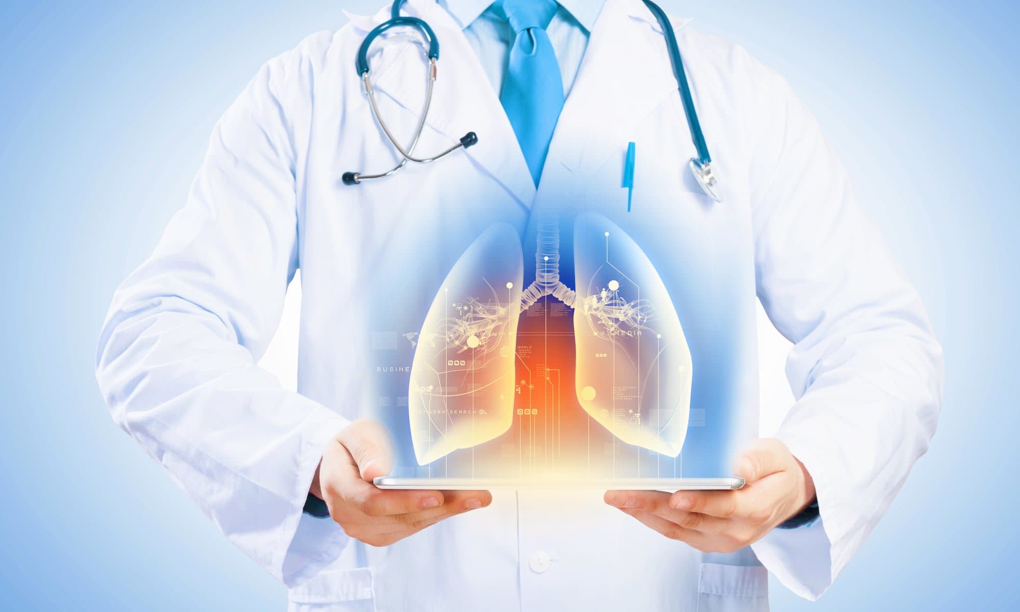 Picture of Close up of doctor's body holding tablet pc with media illustration