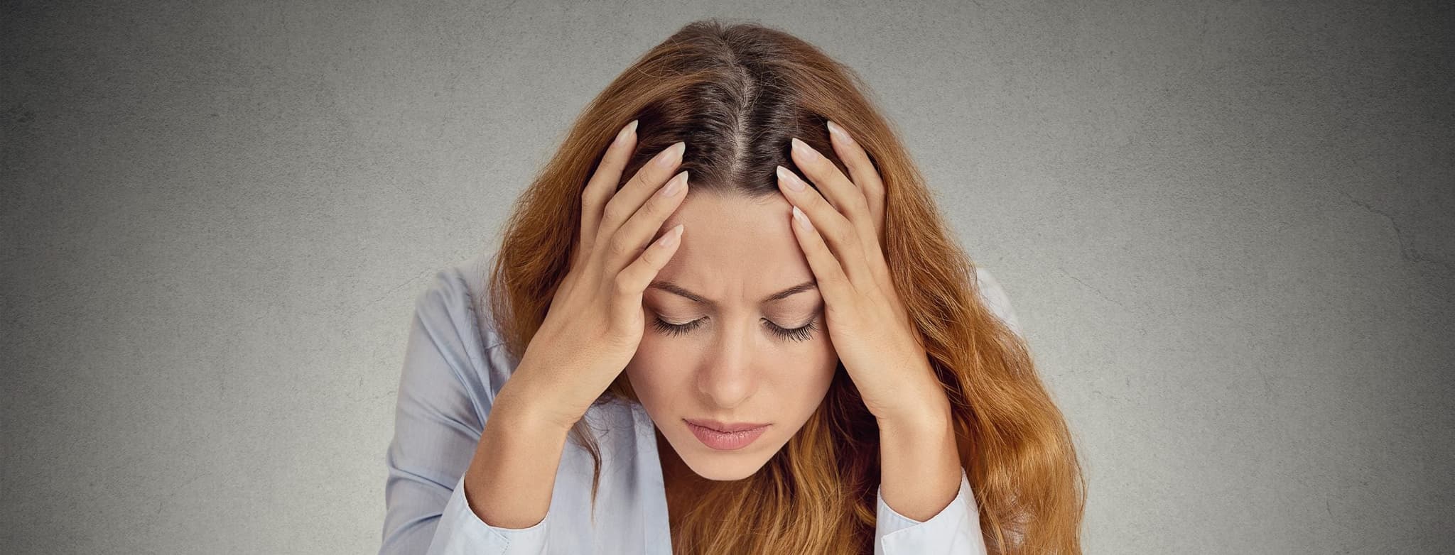 Picture of woman with head in hands - Depression