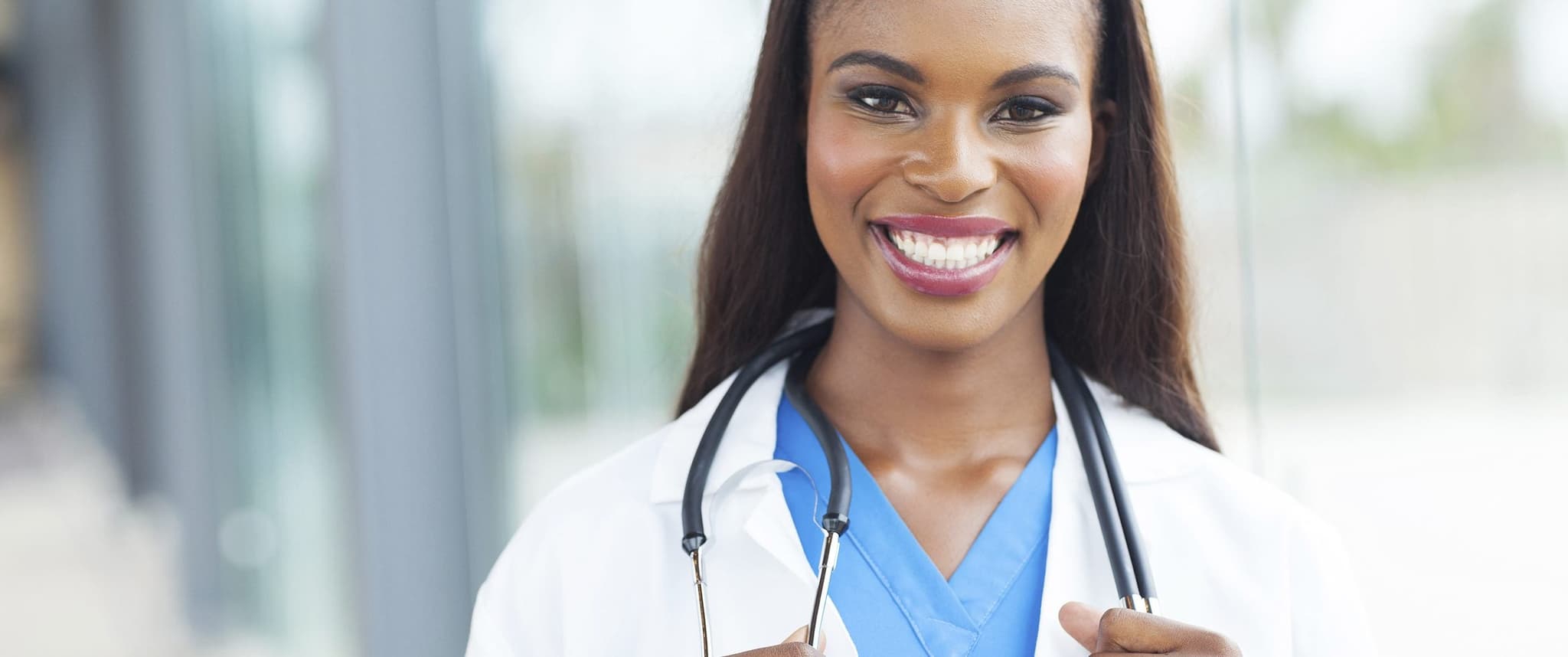 smiling doctor holding stethoscope