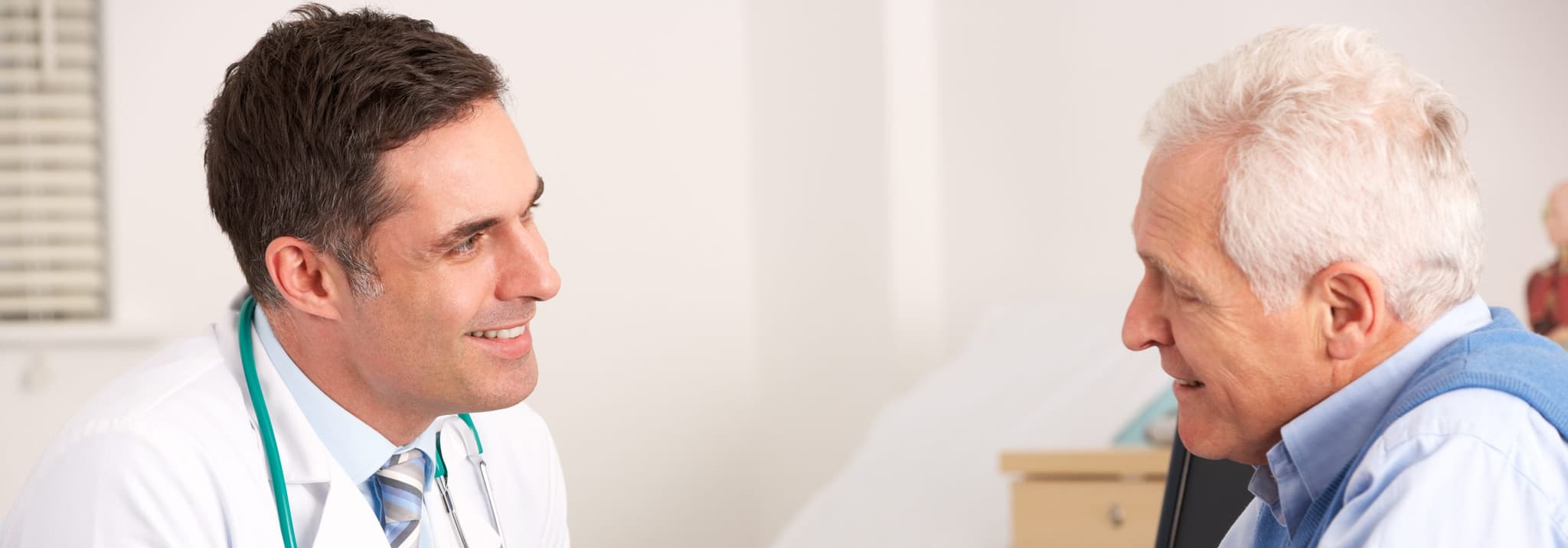 Doctor talking to elderly patient