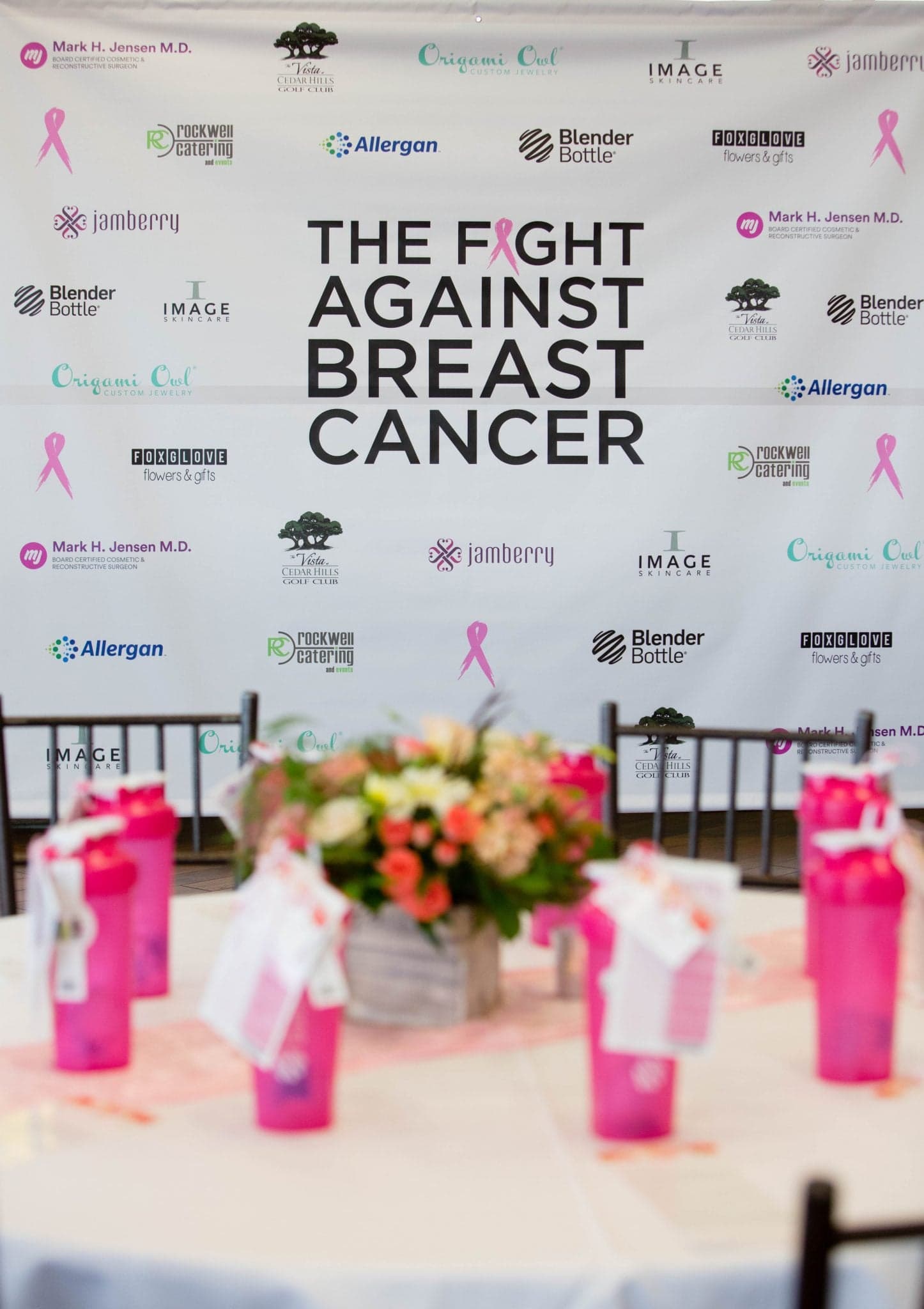 banner with "the fight against breast cancer" at breast cancer event