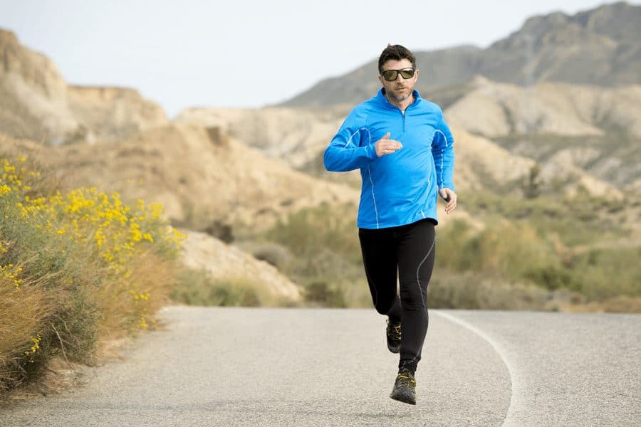 Picture of man jogging down road