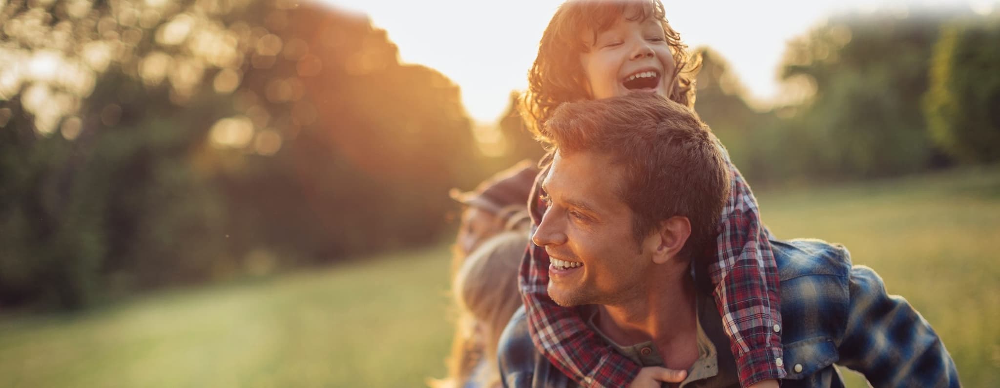 Picture of happy family playing in park - family planning picnic