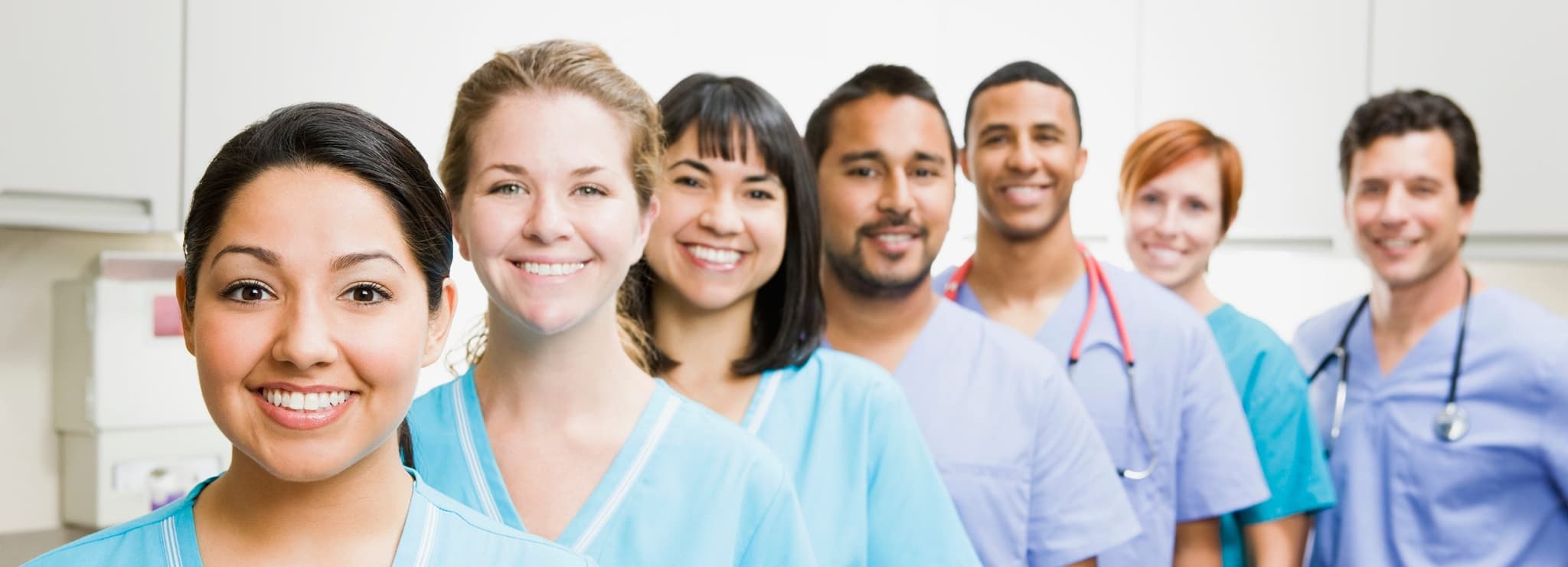 line of smiling doctors