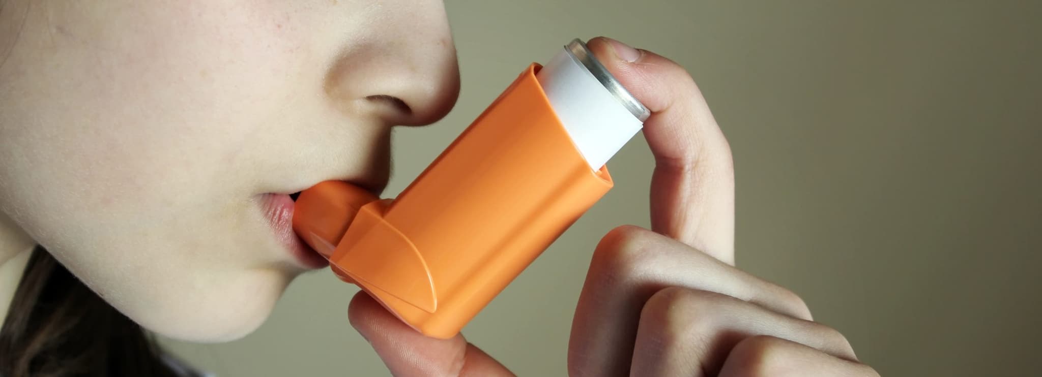 Picture of person using inhaler
