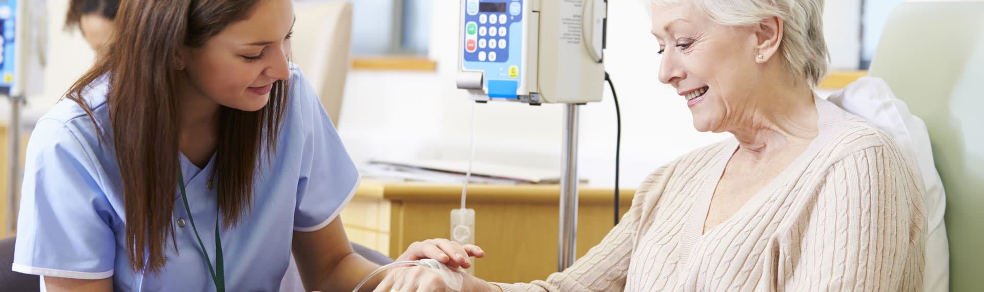 Picture of doctor visiting elderly cancer patient