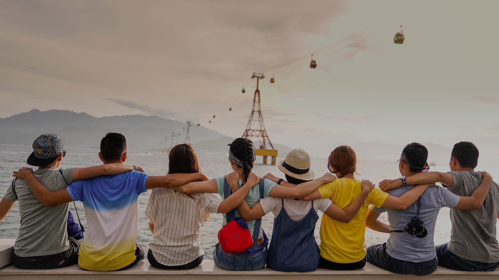 Picture of group of friends putting their arms around each other